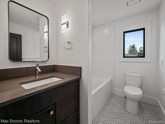 667 Oak Ave, Birmingham, MI 48009 - bathroom featuring toilet, vanity, and baseboards
