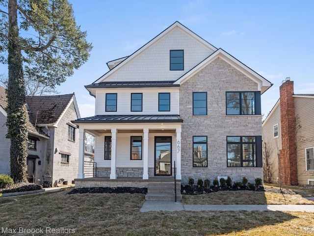 667 Oak Ave, Birmingham, MI 48009 - view of front facade with stone siding, a standing seam roof, and covered porch