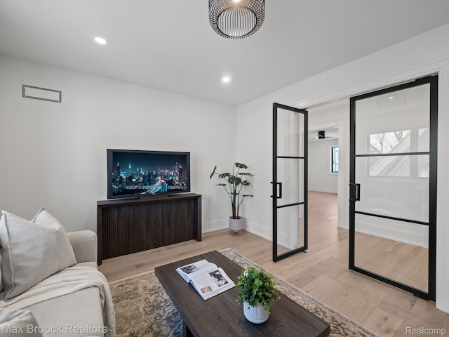 667 Oak Ave, Birmingham, MI 48009 - living area with light wood finished floors, baseboards, and recessed lighting