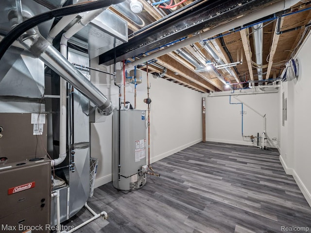 667 Oak Ave, Birmingham, MI 48009 - unfinished basement featuring gas water heater, baseboards, and wood finished floors