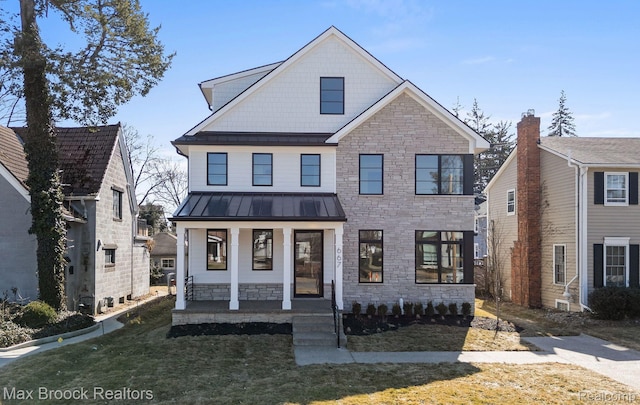 667 Oak Ave, Birmingham, MI 48009 - view of front of property with stone siding, covered porch, a standing seam roof, and a front lawn