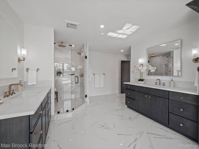 667 Oak Ave, Birmingham, MI 48009 - bathroom with a marble finish shower, two vanities, marble finish flooring, and recessed lighting