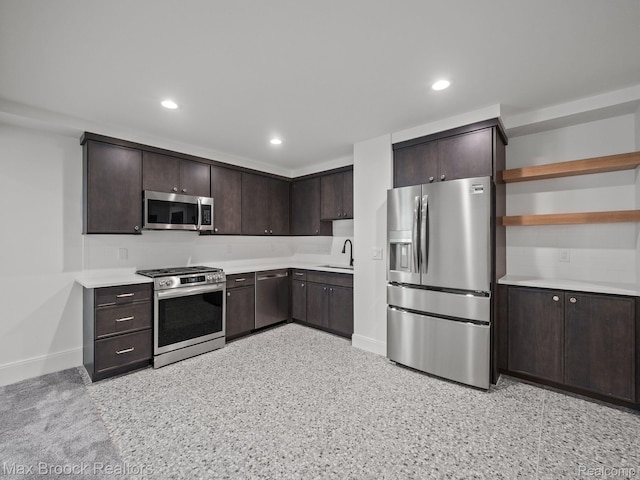 667 Oak Ave, Birmingham, MI 48009 - kitchen with appliances with stainless steel finishes, dark brown cabinets, baseboards, light countertops, and recessed lighting