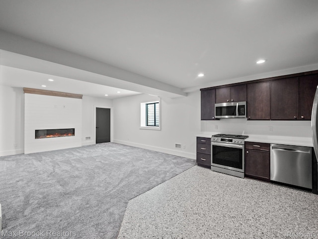 667 Oak Ave, Birmingham, MI 48009 - kitchen featuring stainless steel appliances, baseboards, dark brown cabinetry, recessed lighting, and light countertops