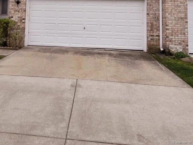 9418 Rayna Dr Unit 62, Davison, MI 48423 - garage featuring concrete driveway