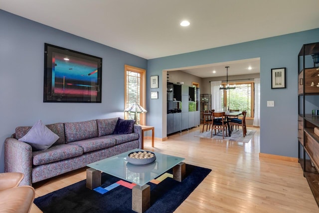 7346 Dunross Dr, Portage, MI 49024 - living room with light wood-type flooring, recessed lighting, baseboards, and a chandelier