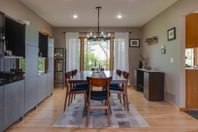 7346 Dunross Dr, Portage, MI 49024 - dining room with light wood-style flooring, a chandelier, baseboards, and recessed lighting