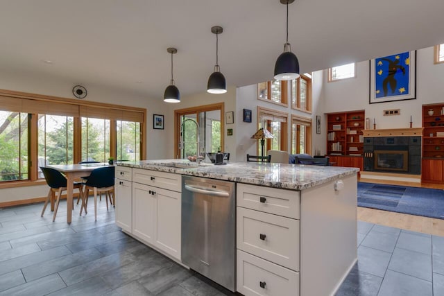 7346 Dunross Dr, Portage, MI 49024 - kitchen with dishwasher, a sink, healthy amount of natural light, and white cabinetry