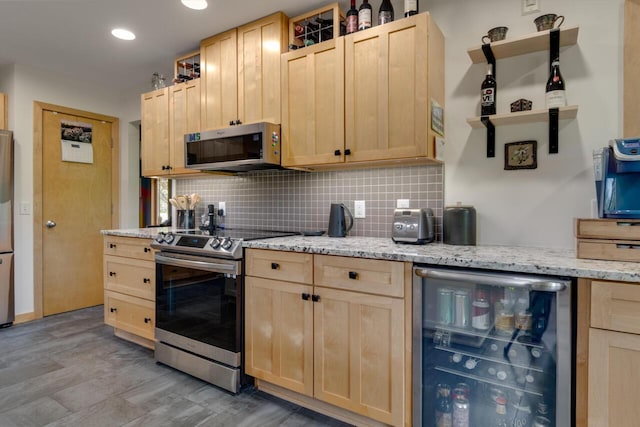 7346 Dunross Dr, Portage, MI 49024 - kitchen with wine cooler, light brown cabinetry, appliances with stainless steel finishes, tasteful backsplash, and light wood-type flooring