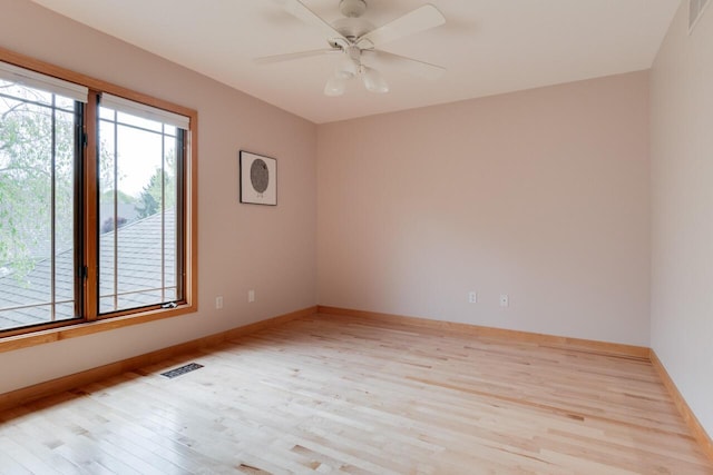 7346 Dunross Dr, Portage, MI 49024 - spare room with light wood-style floors, baseboards, and a ceiling fan