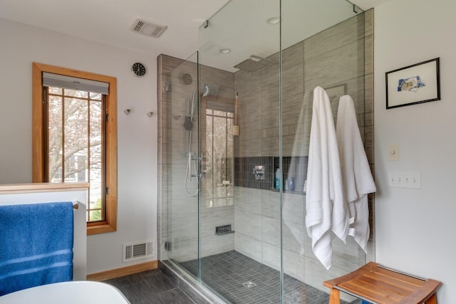 7346 Dunross Dr, Portage, MI 49024 - full bathroom featuring a shower stall, a soaking tub, baseboards, and wood finished floors