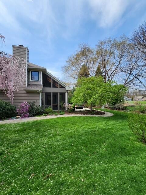 7346 Dunross Dr, Portage, MI 49024 - view of grassy yard with a sunroom