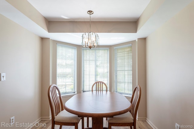 114 Meadow Lane Cir Unit 30, Rochester Hills, MI 48307 - dining space featuring baseboards, light wood-style floors, and a chandelier