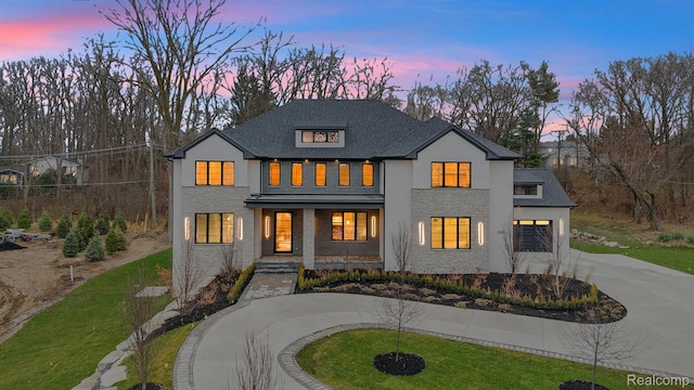 4627 Cimarron Dr, Bloomfield Hills, MI 48302 - modern farmhouse style home featuring curved driveway, a porch, an attached garage, stucco siding, and a lawn