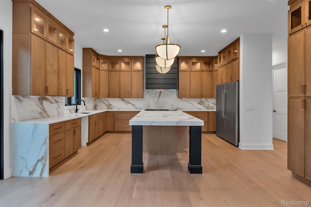 4627 Cimarron Dr, Bloomfield Hills, MI 48302 - kitchen featuring high quality fridge, brown cabinets, decorative backsplash, light wood-type flooring, and recessed lighting