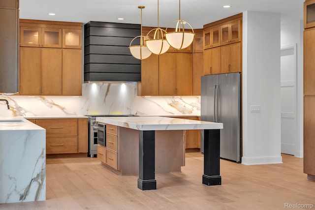 4627 Cimarron Dr, Bloomfield Hills, MI 48302 - kitchen featuring stainless steel appliances, exhaust hood, light wood-style flooring, decorative backsplash, and a kitchen island