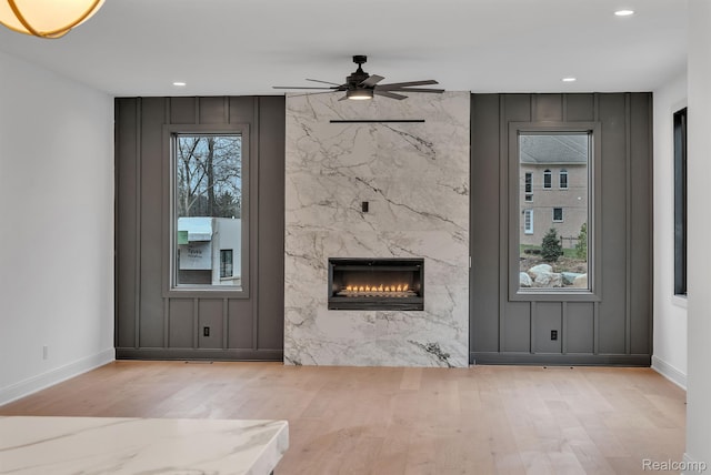 4627 Cimarron Dr, Bloomfield Hills, MI 48302 - unfurnished living room with wood finished floors, a premium fireplace, ceiling fan, recessed lighting, and baseboards
