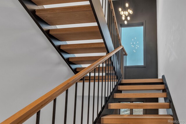 4627 Cimarron Dr, Bloomfield Hills, MI 48302 - stairway featuring a chandelier
