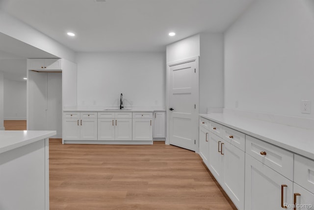 4627 Cimarron Dr, Bloomfield Hills, MI 48302 - bar area with a sink, recessed lighting, and light wood-style flooring