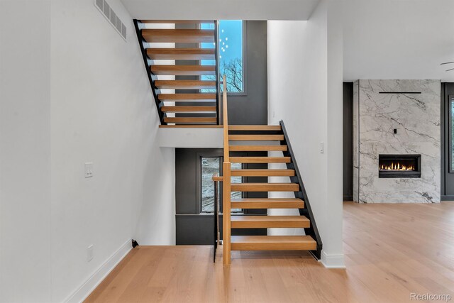 4627 Cimarron Dr, Bloomfield Hills, MI 48302 - stairs with wood finished floors, healthy amount of natural light, and baseboards