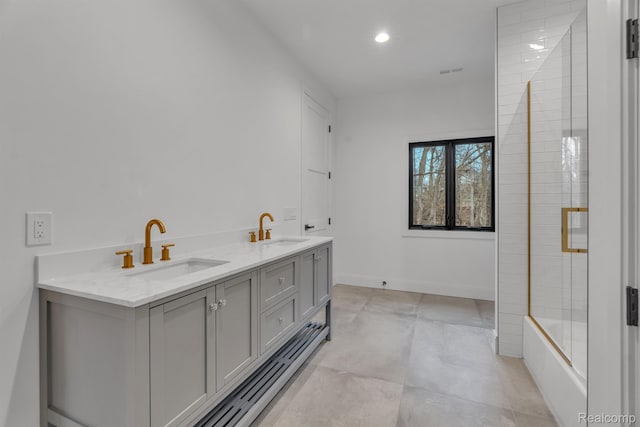 4627 Cimarron Dr, Bloomfield Hills, MI 48302 - full bath with double vanity, bath / shower combo with glass door, recessed lighting, and baseboards