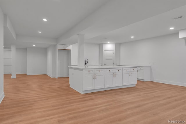4627 Cimarron Dr, Bloomfield Hills, MI 48302 - kitchen with baseboards, light wood-style floors, white cabinetry, and recessed lighting