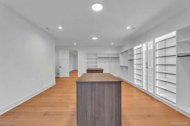 4627 Cimarron Dr, Bloomfield Hills, MI 48302 - walk in closet with light wood finished floors