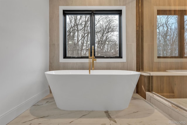 4627 Cimarron Dr, Bloomfield Hills, MI 48302 - full bath featuring a freestanding bath, marble finish flooring, baseboards, and plenty of natural light