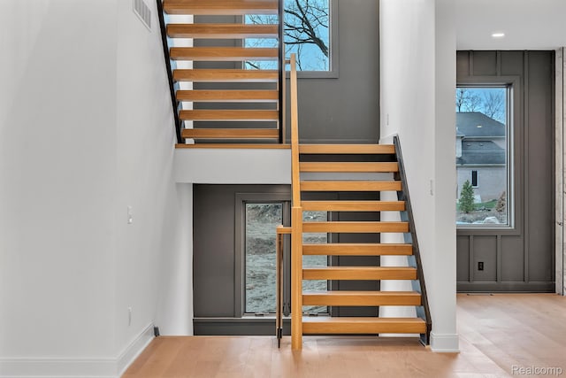 4627 Cimarron Dr, Bloomfield Hills, MI 48302 - stairway with wood finished floors, baseboards, and a towering ceiling