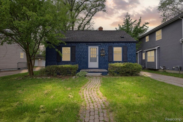 3625 Ellwood Ave, Birmingham, MI 48072 - view of front of home with a lawn and a chimney