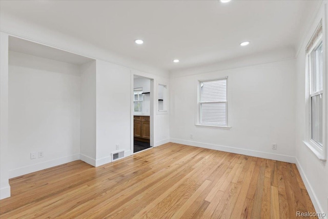 3625 Ellwood Ave, Birmingham, MI 48072 - unfurnished bedroom featuring light wood-type flooring, multiple windows, recessed lighting, baseboards, and ensuite bathroom