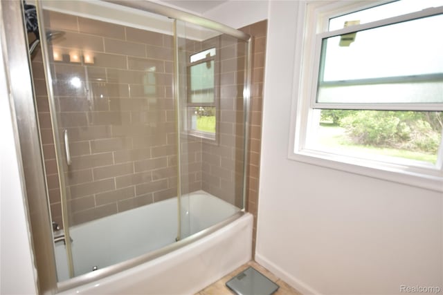1150 E Hill Rd, Grand Blanc, MI 48439 - full bathroom featuring healthy amount of natural light and enclosed tub / shower combo