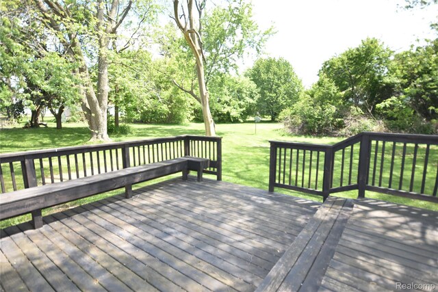 1150 E Hill Rd, Grand Blanc, MI 48439 - deck with view of scattered trees and a yard