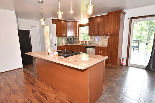 1150 E Hill Rd, Grand Blanc, MI 48439 - kitchen featuring stainless steel dishwasher, decorative backsplash, healthy amount of natural light, and a kitchen island