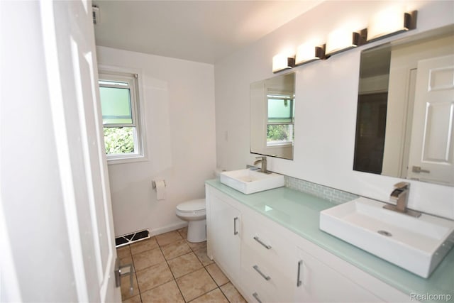 1150 E Hill Rd, Grand Blanc, MI 48439 - full bath featuring double vanity and tile patterned flooring