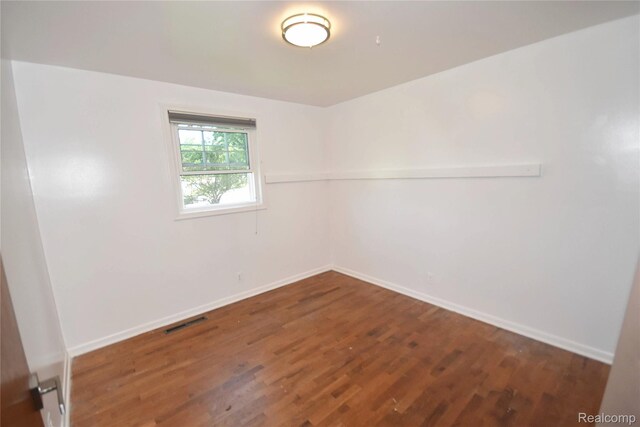 1150 E Hill Rd, Grand Blanc, MI 48439 - empty room featuring wood finished floors and baseboards