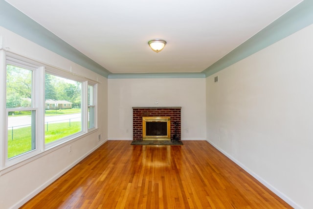 4225 Central Blvd, Ann Arbor, MI 48108 - unfurnished living room featuring light wood-type flooring, baseboards, and a fireplace