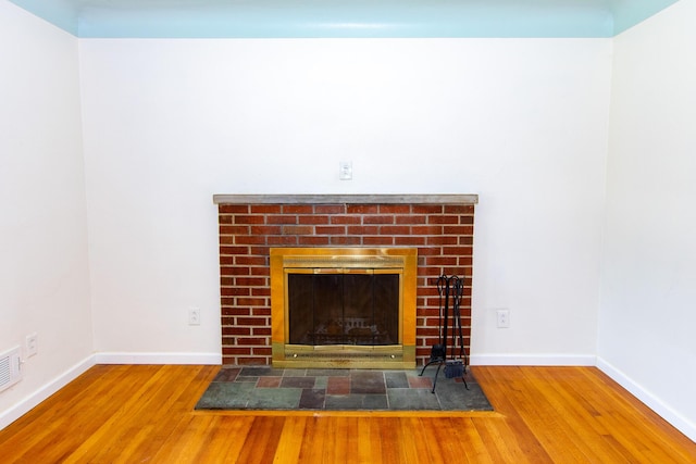 4225 Central Blvd, Ann Arbor, MI 48108 - detailed view of wood finished floors, baseboards, and a fireplace