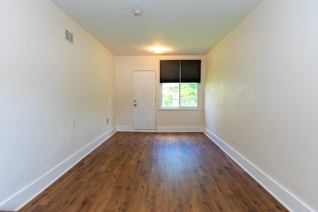 4225 Central Blvd, Ann Arbor, MI 48108 - empty room featuring baseboards, dark wood-style flooring, and a smoke detector