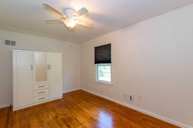 4225 Central Blvd, Ann Arbor, MI 48108 - unfurnished bedroom with wood finished floors, baseboards, and a closet