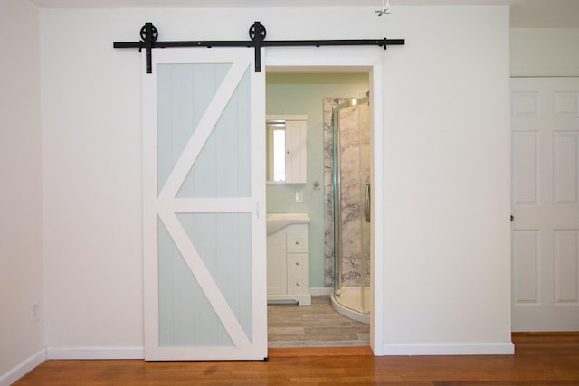 4225 Central Blvd, Ann Arbor, MI 48108 - interior space featuring a shower stall, wood finished floors, and baseboards
