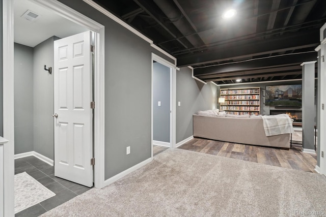 177 Summer Shade Dr, Howell, MI 48843 - finished basement featuring baseboards, a warm lit fireplace, and carpet flooring