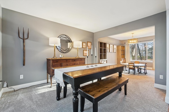 177 Summer Shade Dr, Howell, MI 48843 - carpeted dining space with baseboards and a chandelier