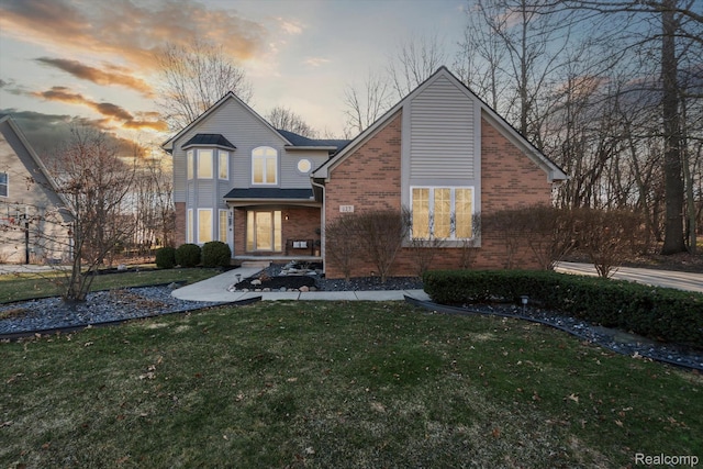 177 Summer Shade Dr, Howell, MI 48843 - view of front of property with brick siding and a lawn
