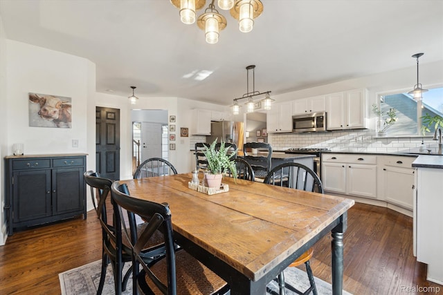 177 Summer Shade Dr, Howell, MI 48843 - dining space featuring dark wood finished floors and a chandelier