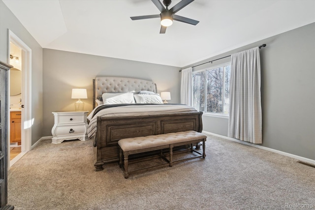 177 Summer Shade Dr, Howell, MI 48843 - carpeted bedroom featuring lofted ceiling, baseboards, ensuite bath, and a ceiling fan