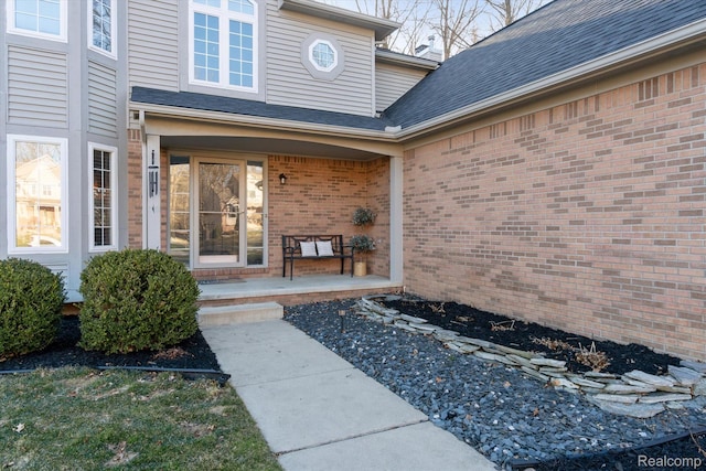 177 Summer Shade Dr, Howell, MI 48843 - view of exterior entry featuring covered porch and brick siding