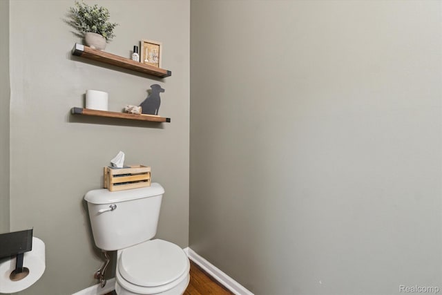 177 Summer Shade Dr, Howell, MI 48843 - bathroom with baseboards, toilet, and wood finished floors