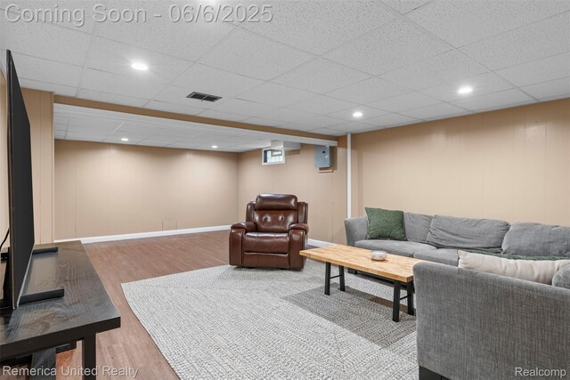 569 Lyon Blvd, South Lyon, MI 48178 - living room with wood finished floors, baseboards, a drop ceiling, and recessed lighting