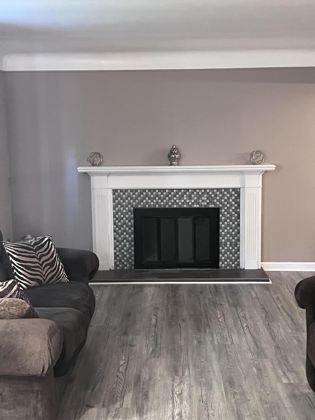 18830 San Quentin Dr, Lathrup Village, MI 48076 - detailed view of a fireplace, wood finished floors, and baseboards